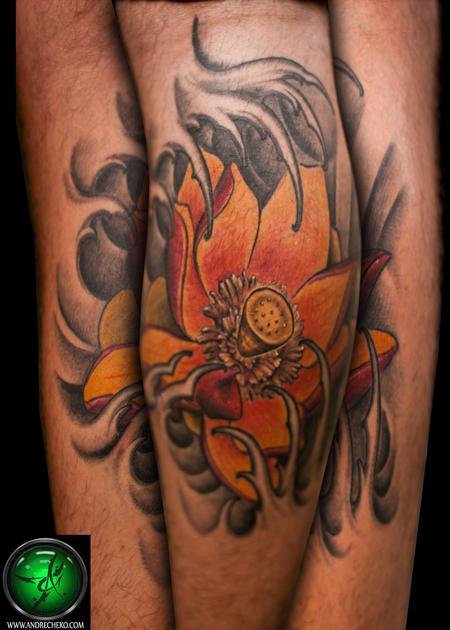 Andre Cheko - Lotus flower leg tattoo